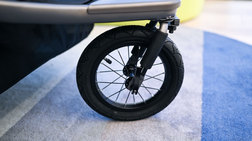 the rubber, air-filled, swivel front wheel helps the joovy make...