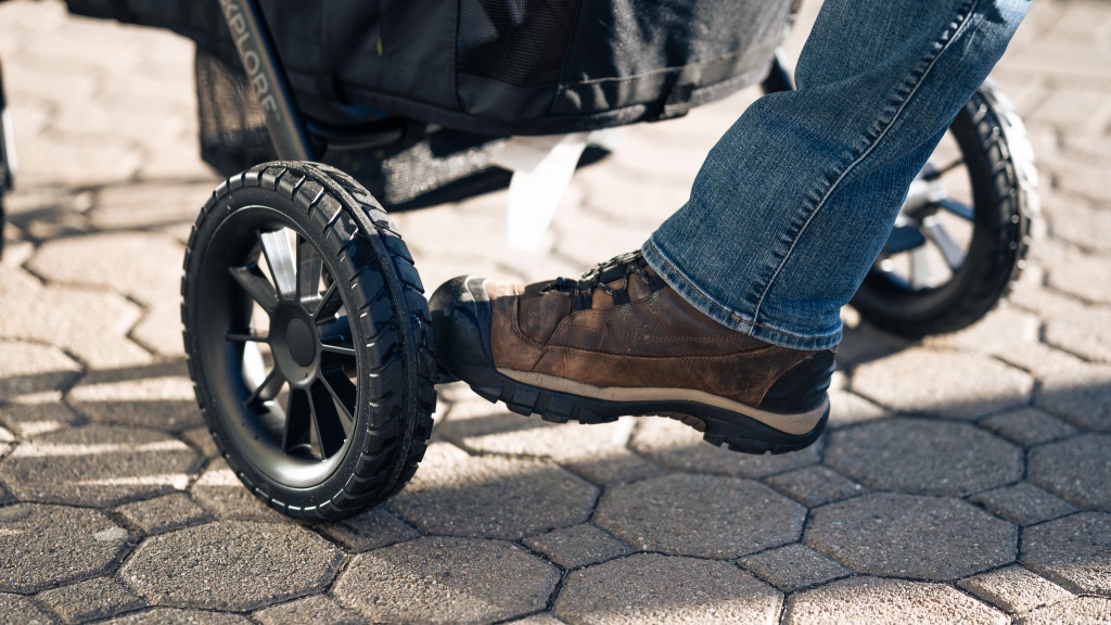 evenflo pivot xplore wagon - the brakes are double-action, which means that you must press two...