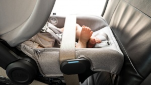 The lap portion of the vehicle belt goes across the foot portion of...