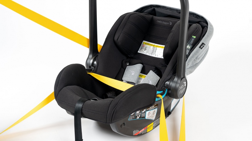 the vehicle lap belt travels across the lap/foot portion of the city...