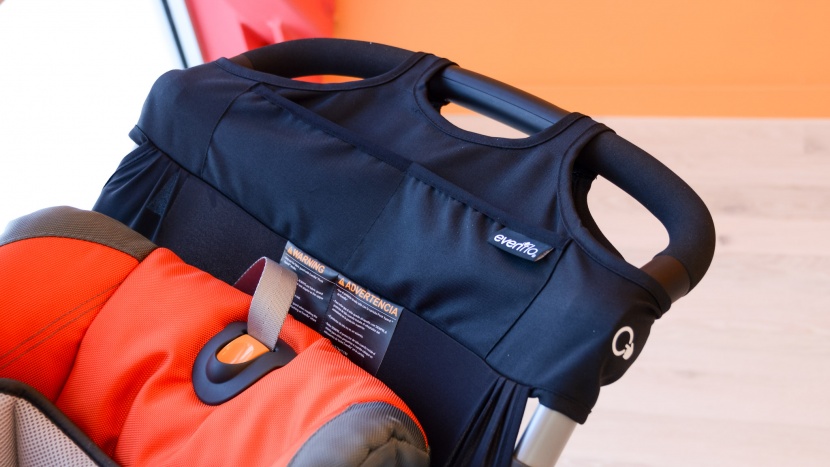 evenflo pivot xpand combo - the xpand has a fabric parent console with open pockets on the top...