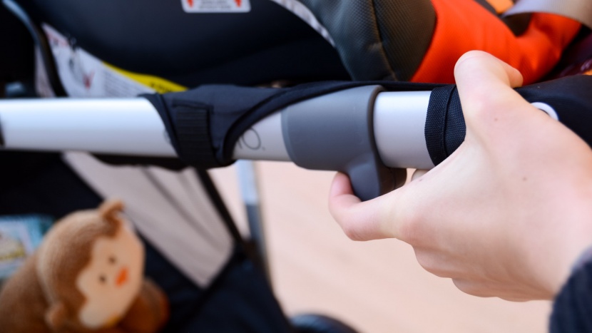 evenflo pivot xpand combo - unlocking the xpand is the first step to folding it.