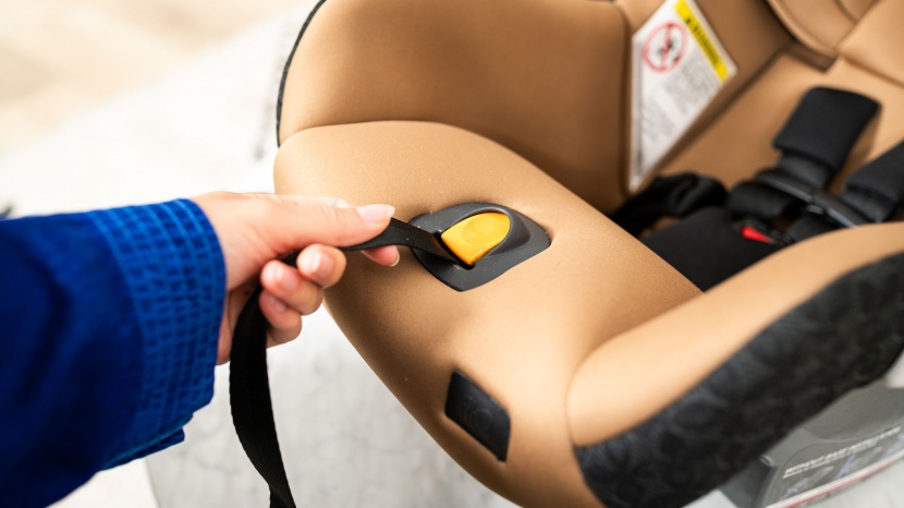 chicco fit2 - the harness tightening strap and release button on the fit 2 are...