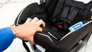 The harness release button on the Lite LX is inside a slit in the...