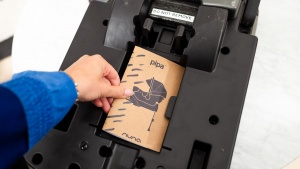 The Nuna manual is tucked under a tab on the bottom of the base. The...