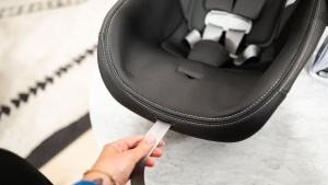 The Peg harness tightening strap is on the edge of the foot portion...