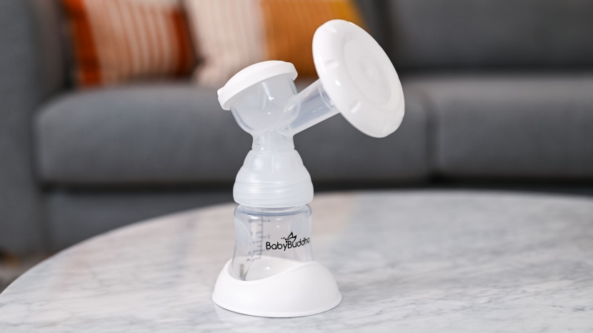 the breast pump's plastic flange features massage cushions on the...