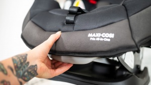 The recline adjustment is on the foot of the seat, and while easy...