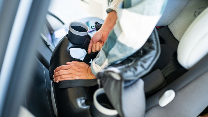 you need to remove the seat fabric of the maxi-cosi to gain access...