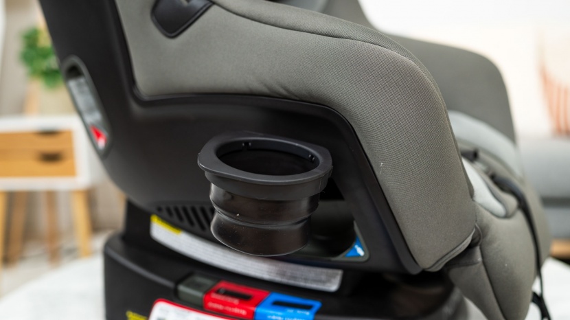 the cup holder on the rava pops out and folds down to use. it isn't...