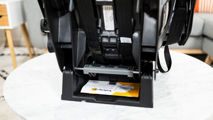 the safety 1st user manual slides under a clip on the base of the...