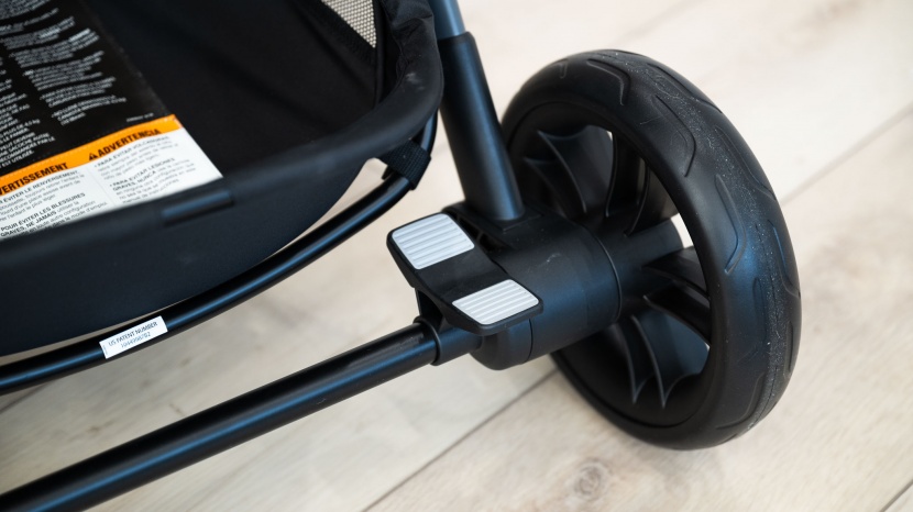 evenflo pivot xpand - while the single-action brake pedal is close to the right wheels, it...