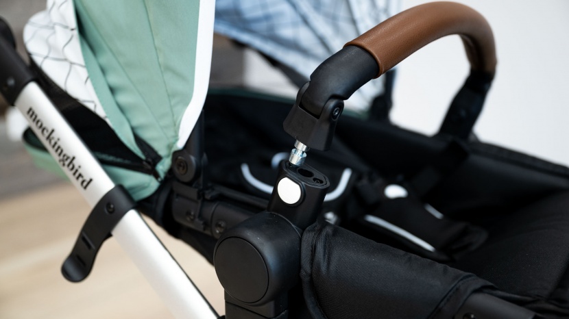 the belly bar on the mockingbird seat swings aside to make it easier...