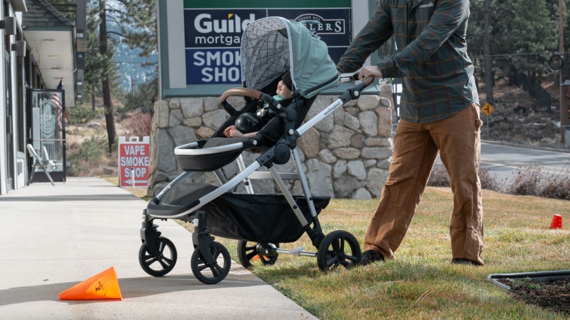 the strollers were pushed on and off of grass to sidewalks to mimic...