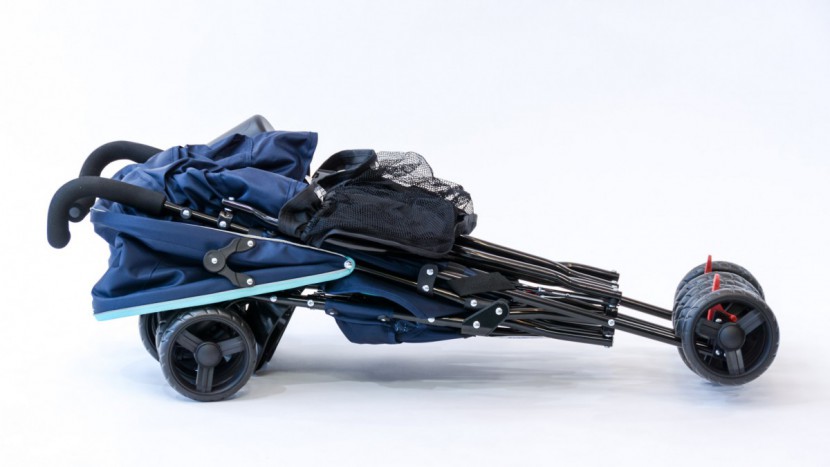 double travel stroller - the delta side by side folds like a traditional umbrella stroller.