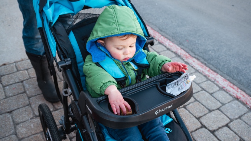 the race tech has a child's snack tray with two shallow cup holders.