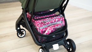 We were able to fit our large diaper bag inside, but it was a...