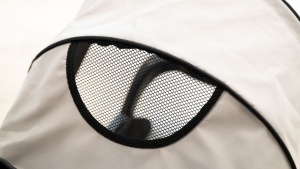 The Kolcraft has a smaller peek-a-boo window with no cover, so...