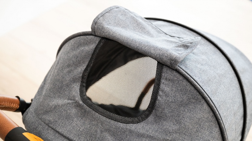 the zoe has a giant canopy with a small mesh peek-a-boo window and...