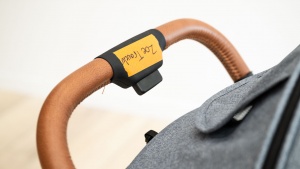 The release button on the Zoe handlebar initiates the folding process.