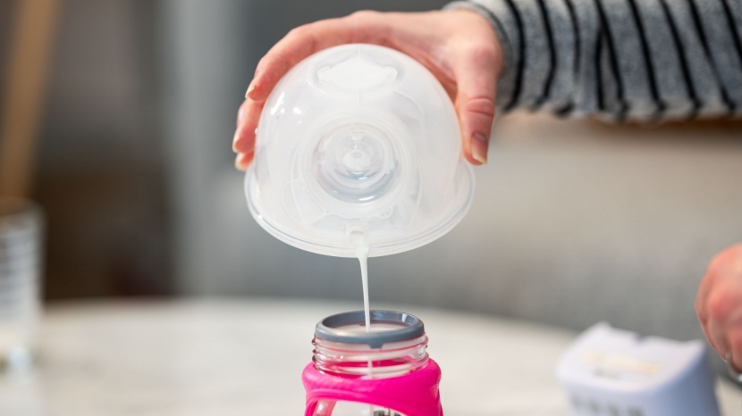 breast pump - with some breast pump systems, you must carefully pour the expressed...