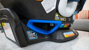 The rear-facing belt path on the Graco Turn2Me is color-coded in...