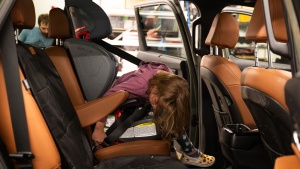 Younger or shorter passengers might struggle to reach the buckle by...