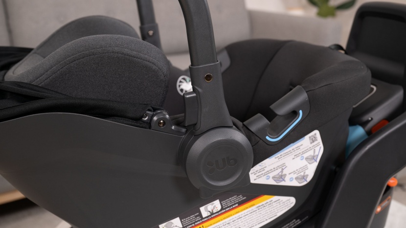 uppababy aria - the aria handle adjustment button is on the handle instead of the...