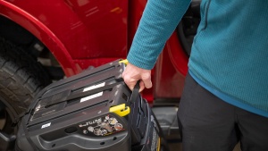 The bottom of the Shuttle Plus seat has a handle for carrying.