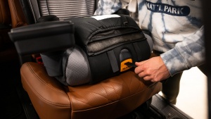 Tightening the LATCH strap on the Air Plus is an easy-to-pull front...