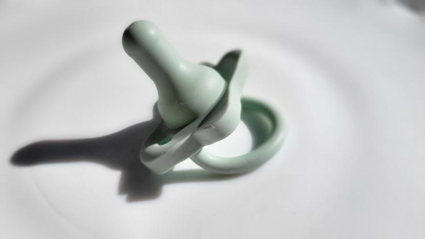 pacifier - dr. brown&#039;s happypaci is one piece and has a large sturdy handle.