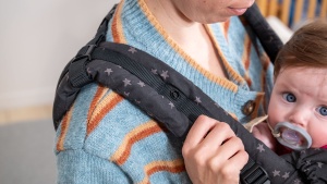 The wider, padded shoulder straps on the Free-to-Grow help parents...