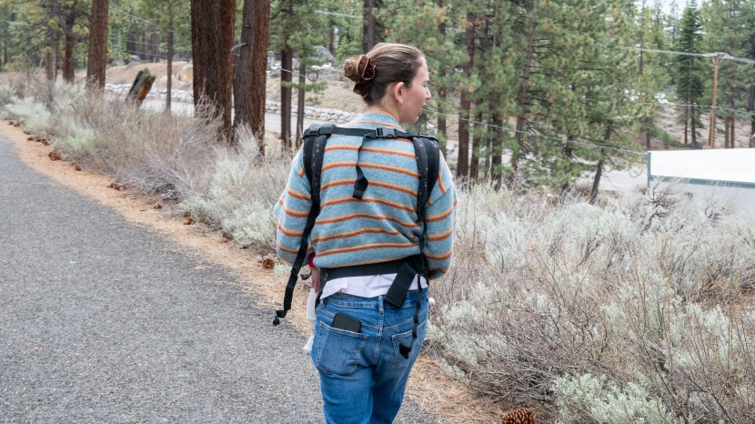 the back straps on the tula are easy to slide on and clip, assuming...
