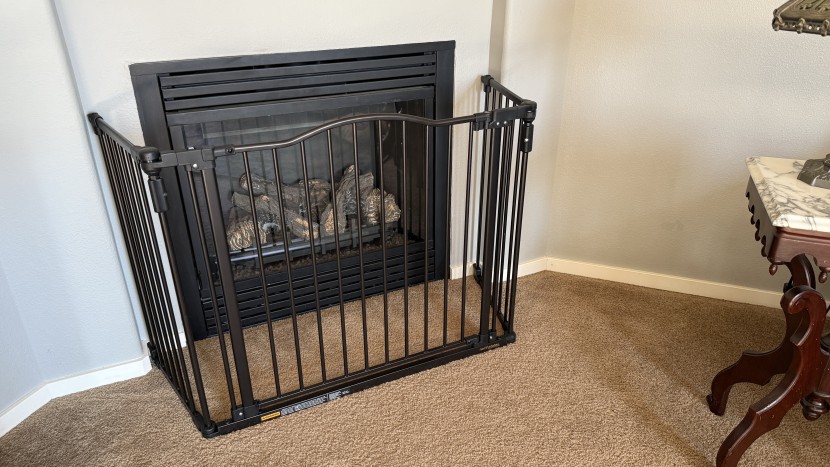 baby gate - the three panels of the toddleroo bend and attach to the wall...