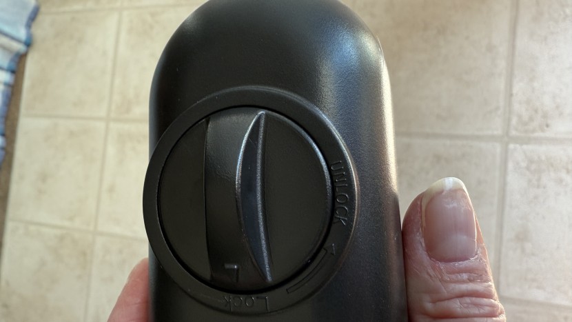 baby gate - the mesh, retractable cumbor requires two hands to open and close...