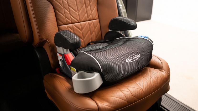 graco turbobooster backless - the only thing between the passenger tushie and the booster seat is...