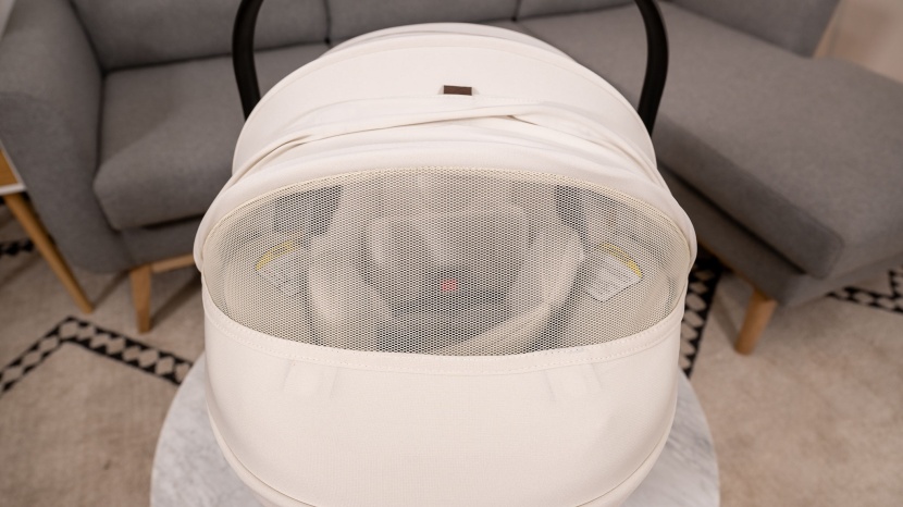 the juni canopy has a ventilation panel that allows you to peek...