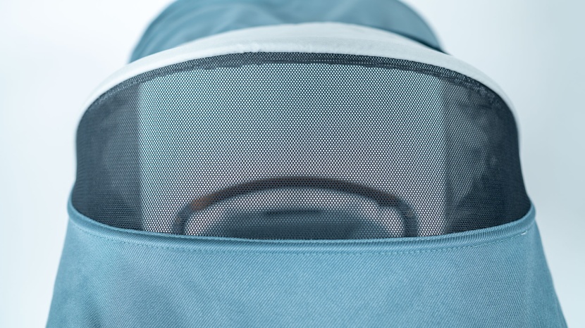 the canopy unzips to extend coverage and features a mesh panel for...