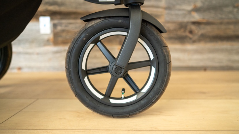 the front wheel is smaller and features reflective trim for...