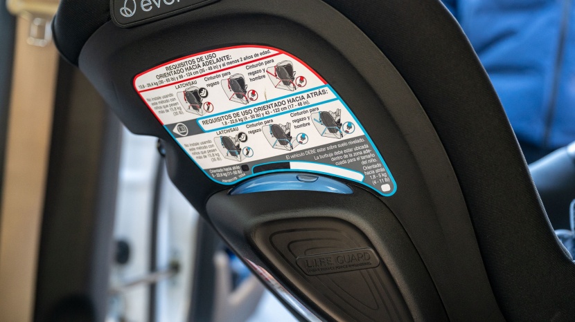 evenflo revolve360 slim  2-in-1 - the revolve shell is busy with instructional stickers.