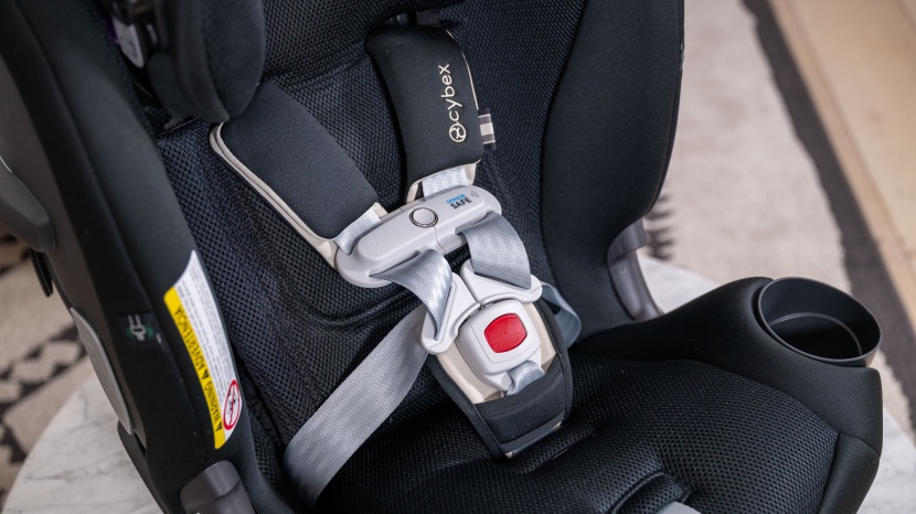 the shoulder strap padding extends down behind the chest clip, which...