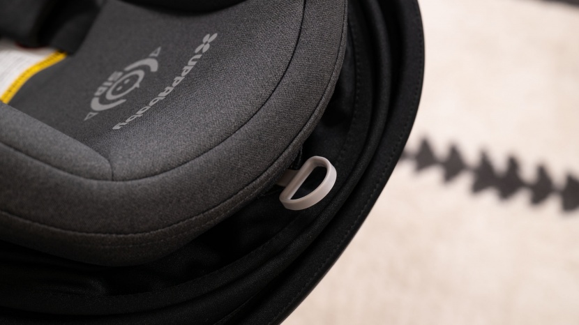 the aria pull tab at the top of the headrest adjusts the shoulder...