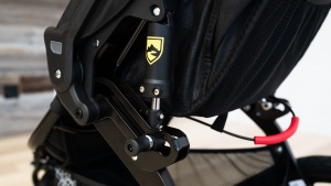 The fold handle on the Revolution is read and located under the back...
