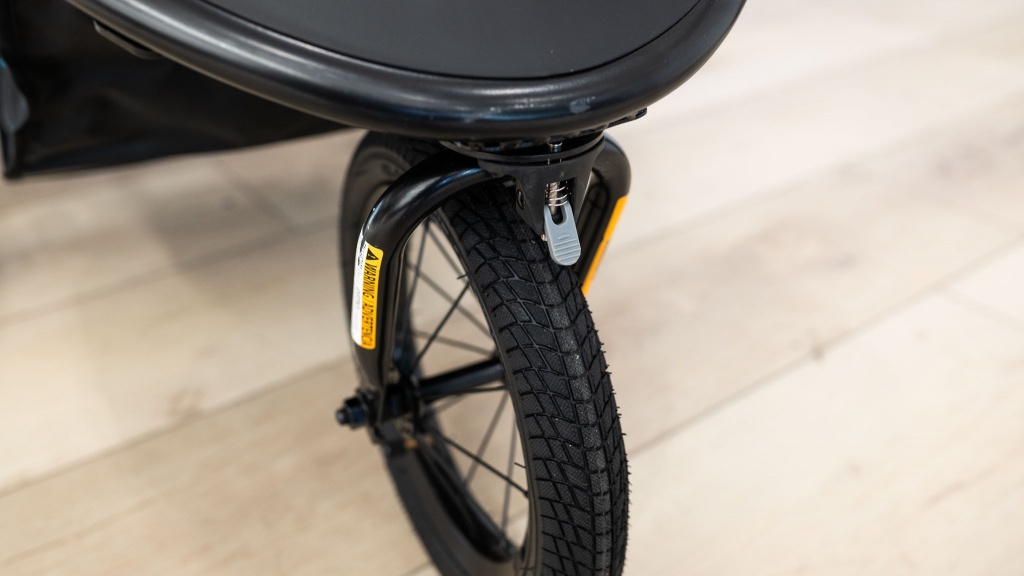 baby trend expedition race tec - the front wheel locking mechanism on the race tec is a flip tab on...